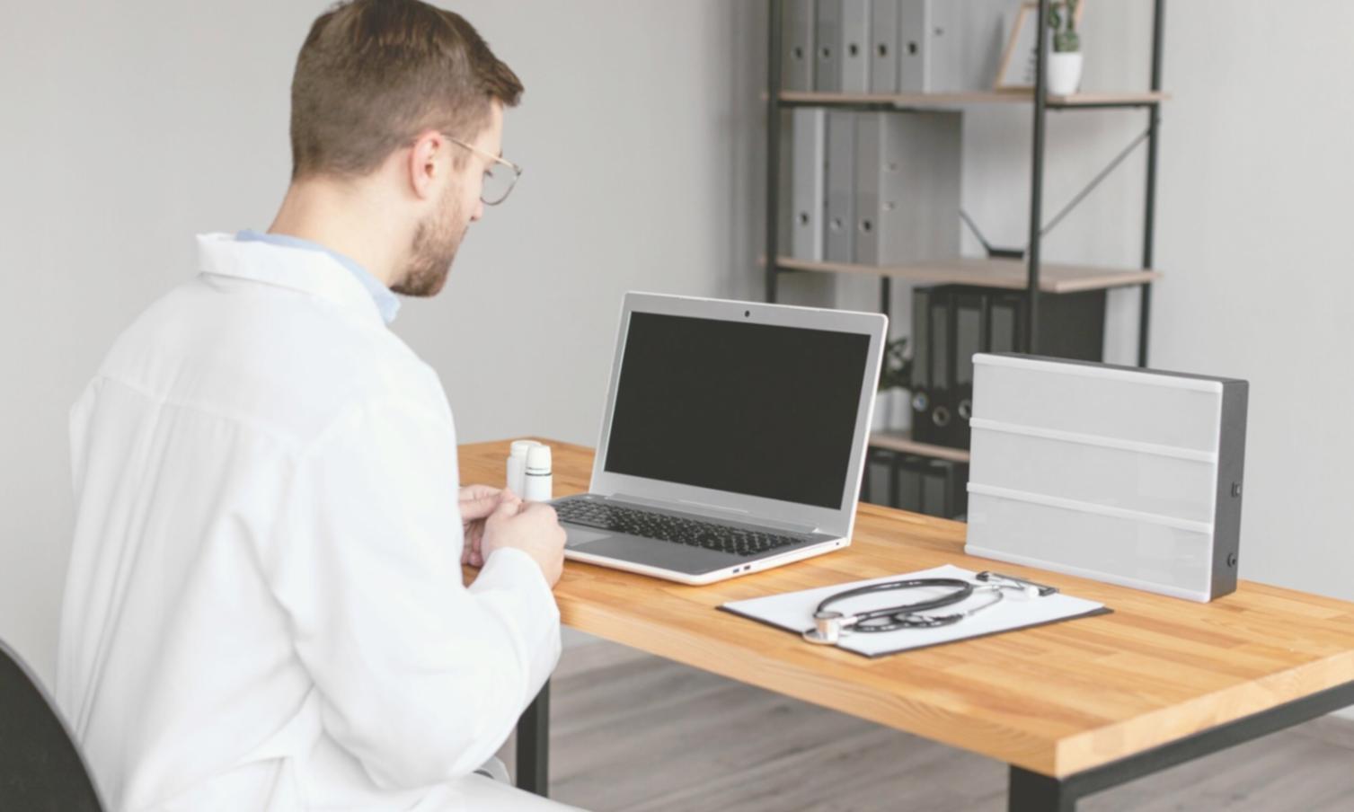 Market analysis charts and financial planning documents on desk